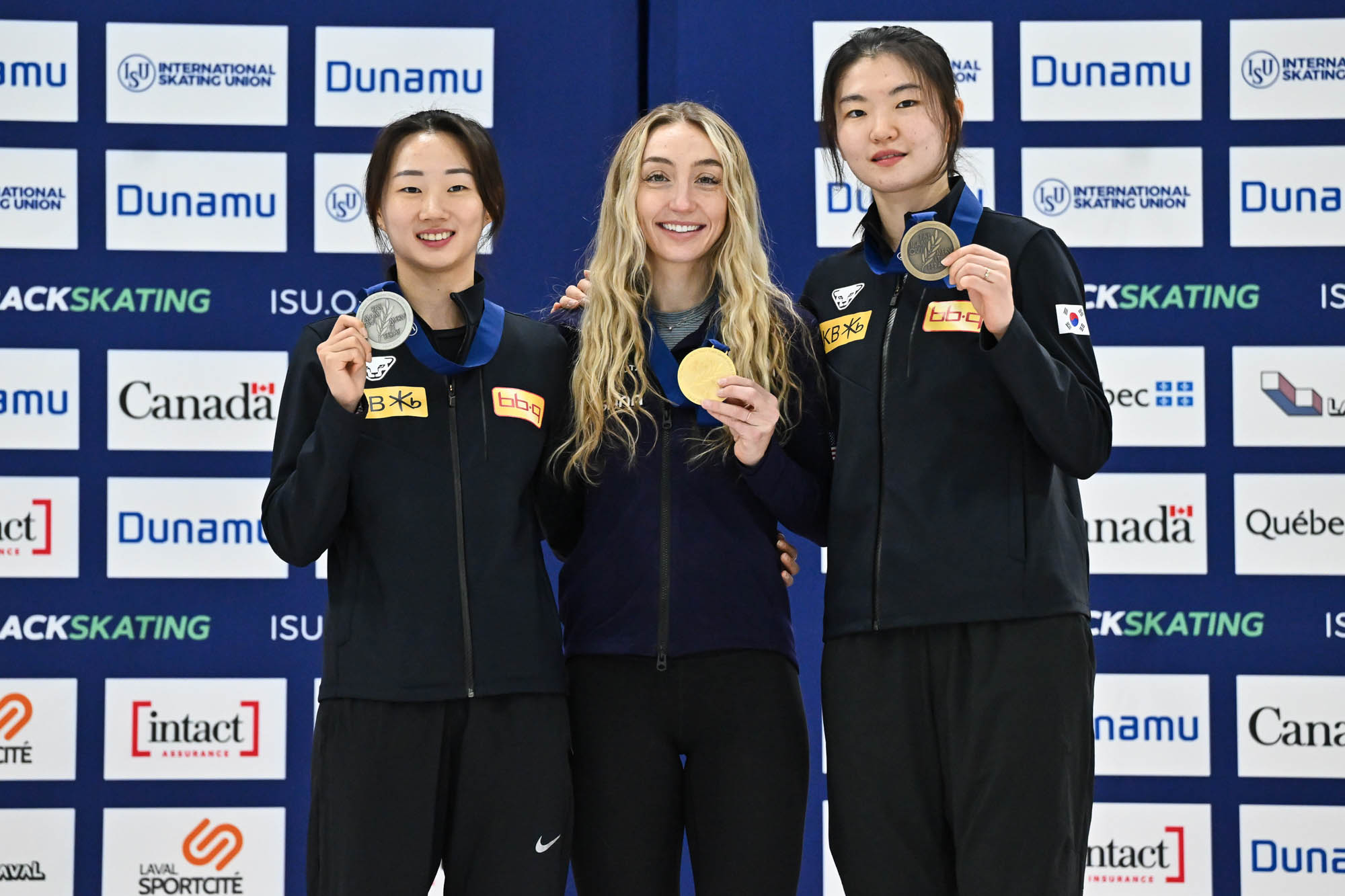 LAVAL, CANADA - NOVEMBER 04:  (L-R) Park Jiwon of the Republic of Korea, Kristen Santos-Griswold of the United States of America and Shim Suk Hee of the Republic of Korea pose with their medals after competing in the women’s 500 m final during the ISU Four Continents Short Track Speed Skating Championships at Place Bell on November 4, 2023 in Laval, Quebec, Canada.  (Photo by Minas Panagiotakis - International Skating Union/International Skating Union via Getty Images)